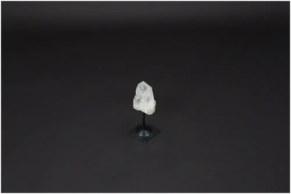 Lemurian Quartz Crystal on metal stand, promoting clarity and balance; ethically sourced and naturally formed for personal growth.
