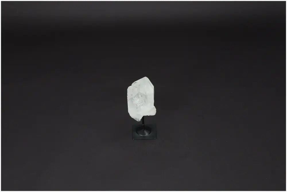 Lemurian Quartz crystal on metal stand, amplifying energy and promoting clarity, ethically sourced and naturally formed.