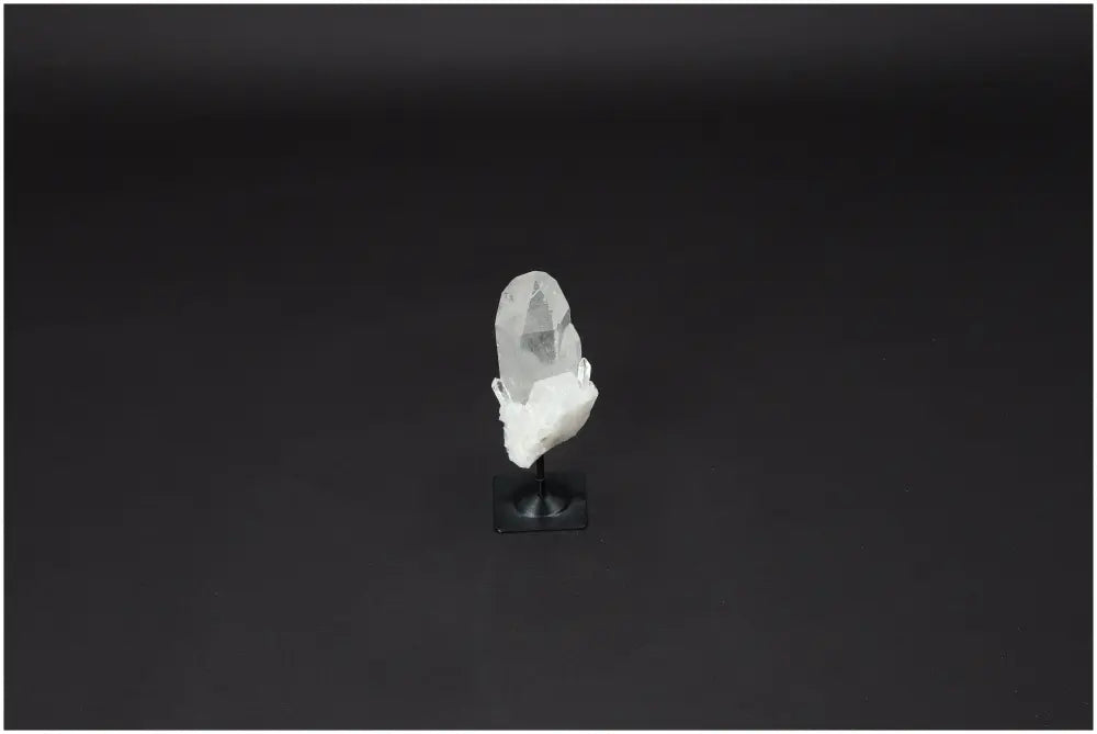 Lemurian Clear Quartz crystal on metal stand, symbolizing clarity and healing, ideal for energy amplification and personal growth.