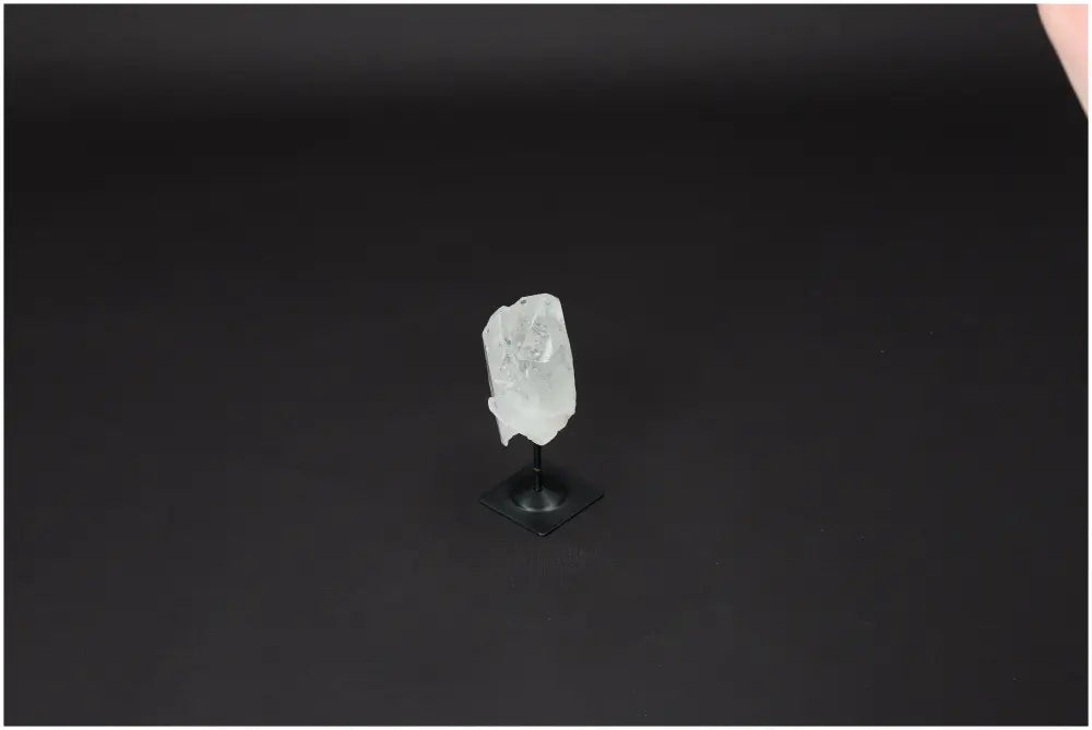 Lemurian Quartz crystal on metal stand, showcasing its natural beauty and clarity, ideal for energy amplification and personal growth.