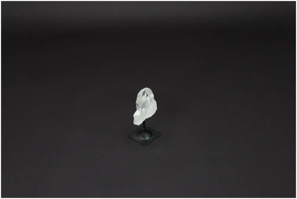 Lemurian Quartz crystal on metal stand, known as 'Master Healer', promotes clarity, balance, and growth. Ethically sourced natural stone.