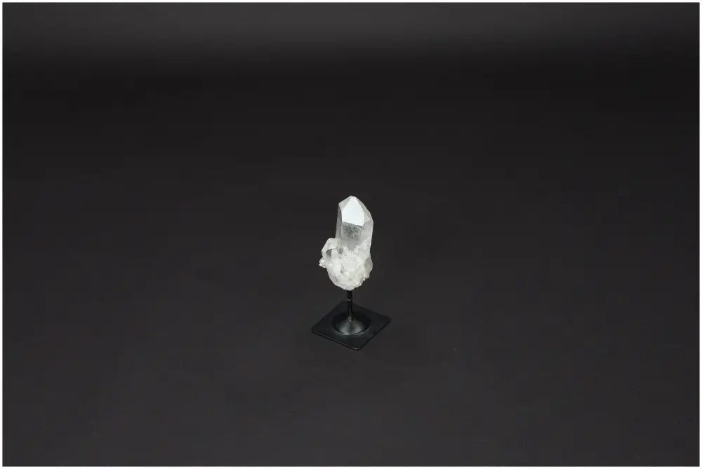 Lemurian Quartz on metal stand, a powerful purification stone to harmonize body, mind, and energy by neutralizing negative vibrations.
