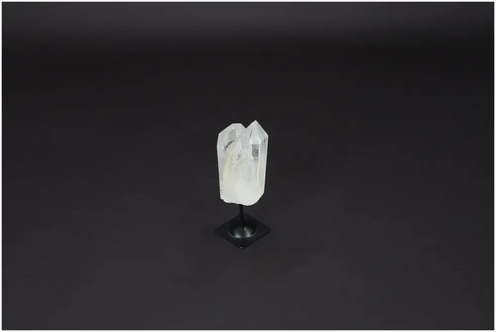 Lemurian Quartz on Metal Stand, a powerful purification crystal that dispels negativity and cleanses space. Ideal for harmonizing energy.