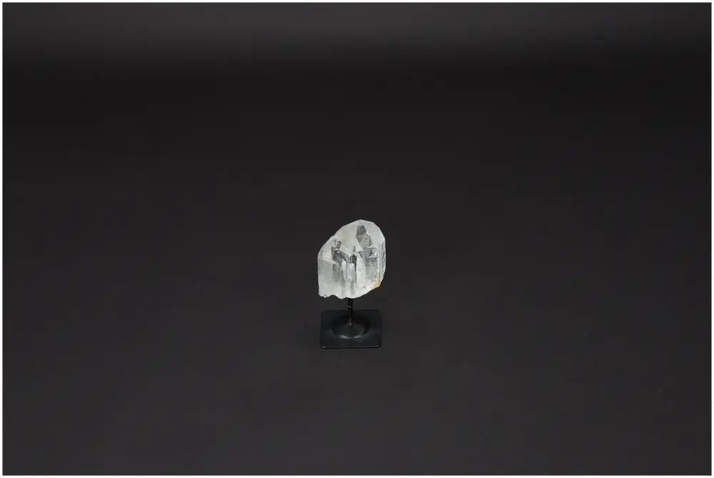 Lemurian Quartz on metal stand, showcasing its clear crystal properties and ability to harmonize energy, perfect for purification and EMR protection.