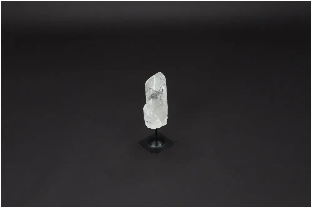 Lemurian Quartz on metal stand, a clear quartz known for purification and neutralizing negative energy, enhancing space and well-being.