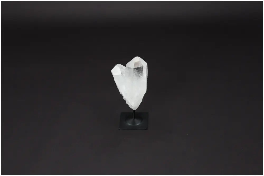 Lemurian Quartz on metal stand, a clear quartz crystal known for purification, absorbs negative vibes, ideal for home and office.