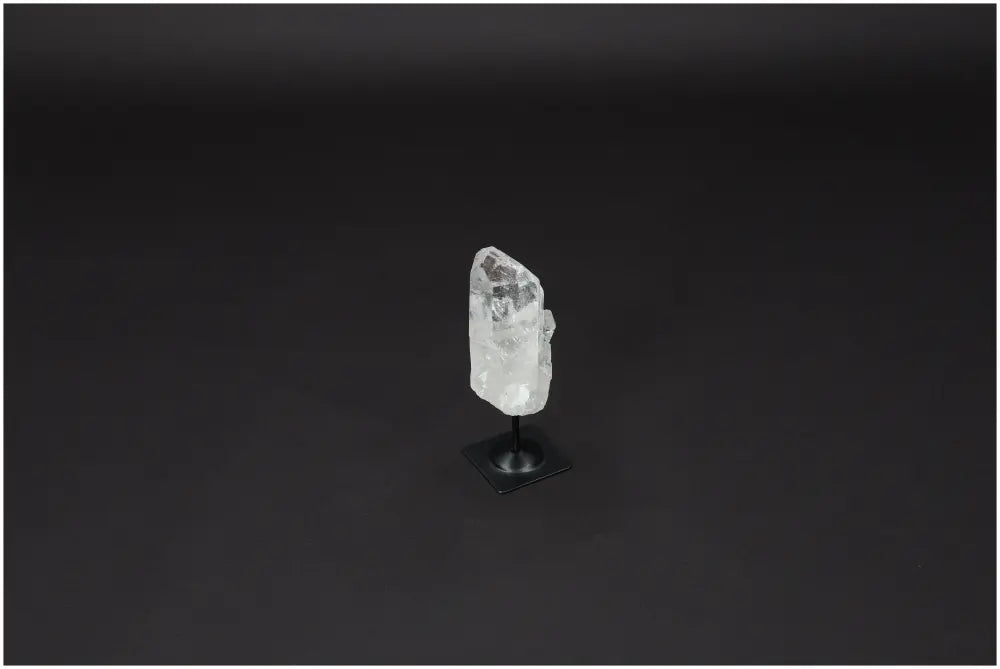 Lemurian Clear Quartz on a metal stand, perfect for purification, harmonizing energy, and neutralizing negative vibrations.