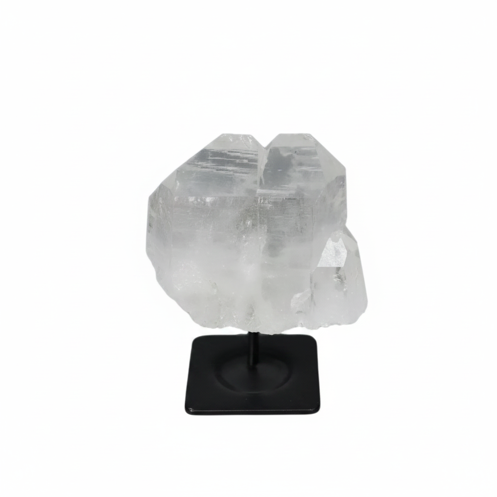 Lemurian Quartz on a black metal stand, showcasing its clear, purifying properties for harmonizing body and mind.