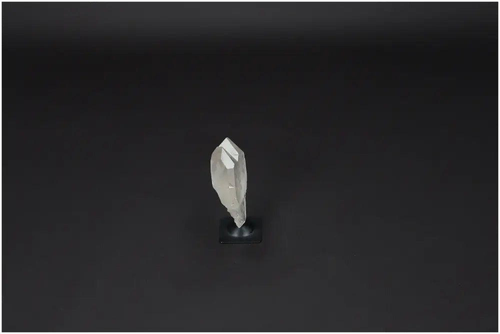 Lemurian Quartz crystal on a metal stand, purifying energy and neutralizing negativity, suitable for daily use and space cleansing.