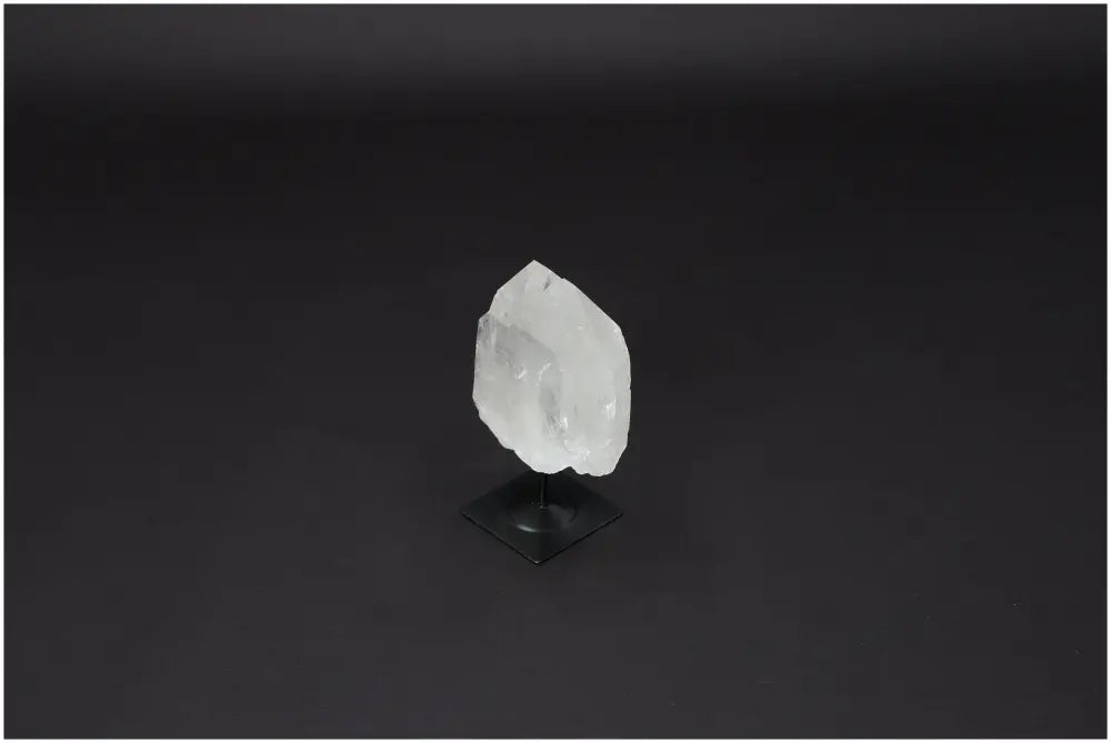 Lemurian Quartz on metal stand, clear stone for purification, harmonizing energy, and neutralizing negative vibrations.