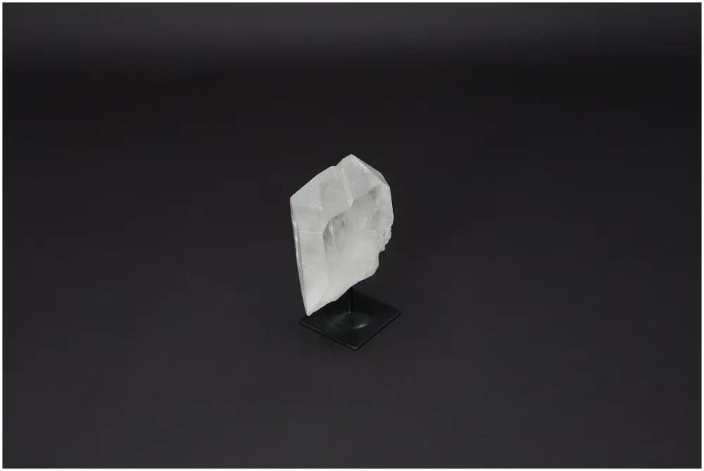 Lemurian Quartz on metal stand, showcasing its clear crystal structure, ideal for energy purification and neutralizing negative vibes.