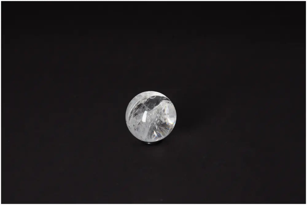 Lemurian Quartz Sphere 3-4 CM displaying radiant energy and spiritual growth properties on a dark background.