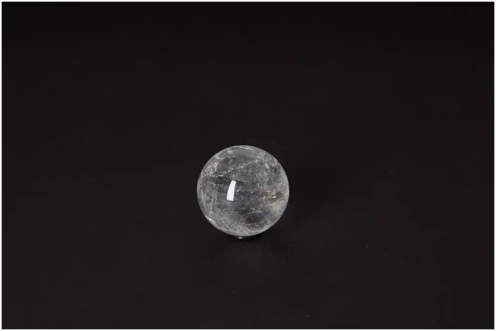 Lemurian Quartz Sphere 4-5 CM on black background, embodying ancient wisdom and radiant energy for spiritual growth and clarity.