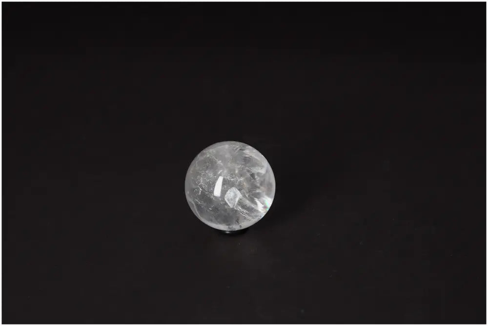 Lemurian Quartz Sphere 4-5 CM showcasing its radiant, high-vibrational energy and luminous clarity on a dark background.