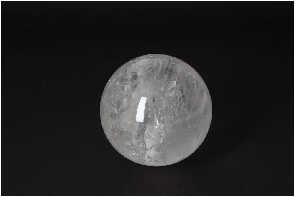 Lemurian Quartz Sphere 8-9 CM with radiant clarity and subtle striations, embodying high-vibrational energy and ancient wisdom.