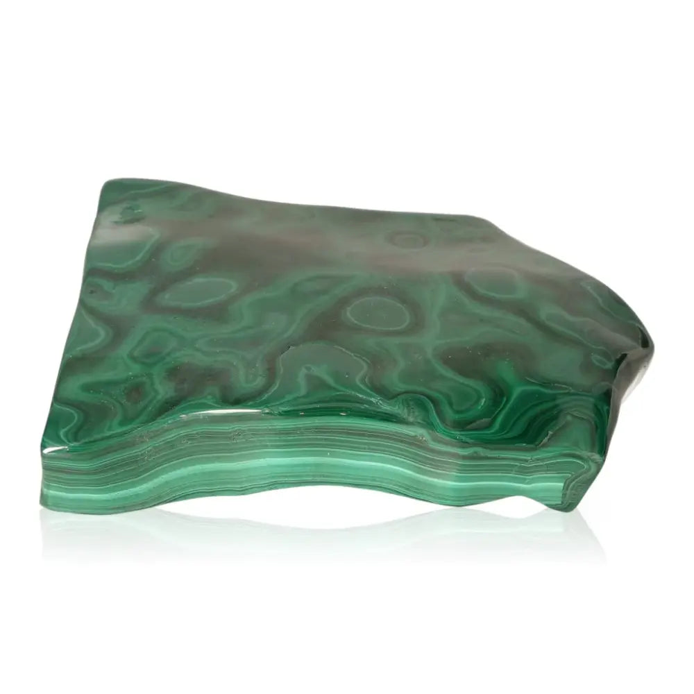 Vibrant green malachite stone with intricate patterns, known for its soothing energy and courage-inspiring properties.