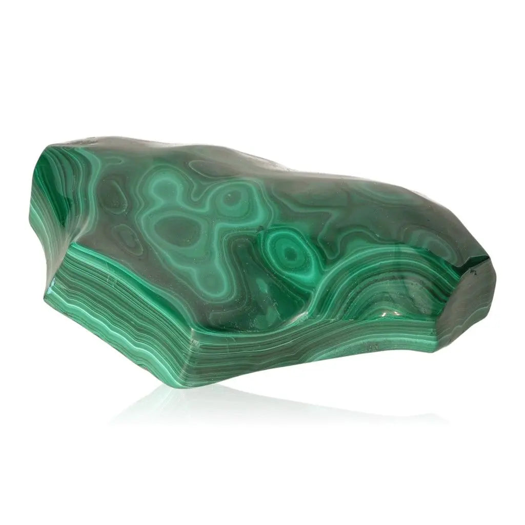 Polished malachite gemstone with green swirling patterns, known for promoting tranquility and courage; ideal for meditation and healing.