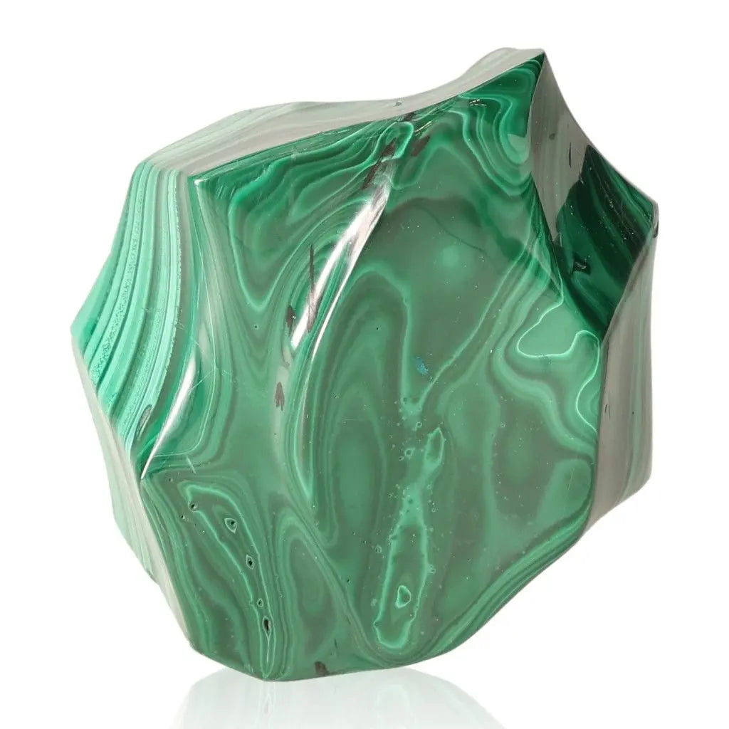Vibrant green malachite gemstone, revered for soothing energy, infusing courage and hope, aiding in life's transitions with harmony.