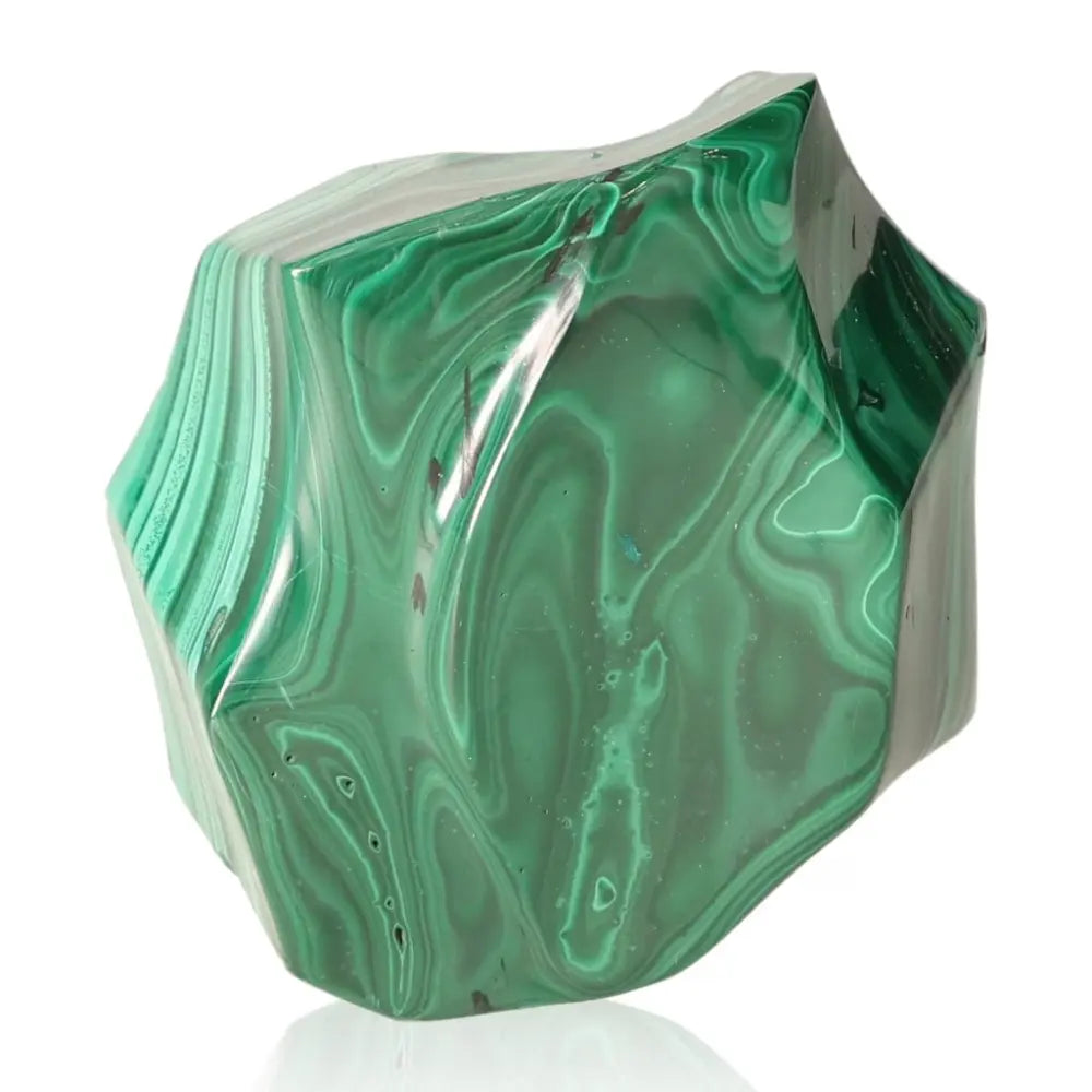 Malachite gemstone with green marbled patterns symbolizing courage and hope, ideal for transitions and open-hearted approaches.