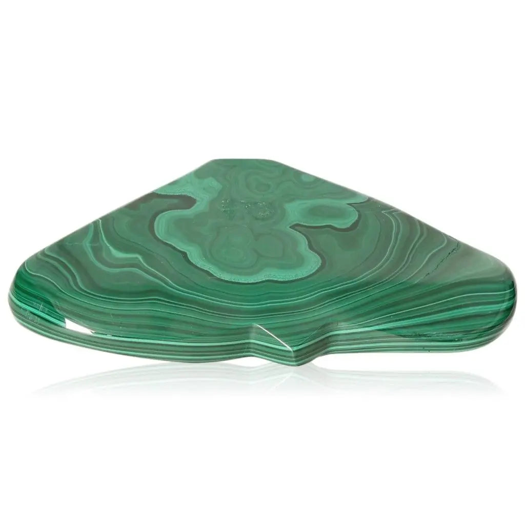 Polished triangular malachite stone with swirling green patterns, symbolizing nature's soothing and uplifting energies.