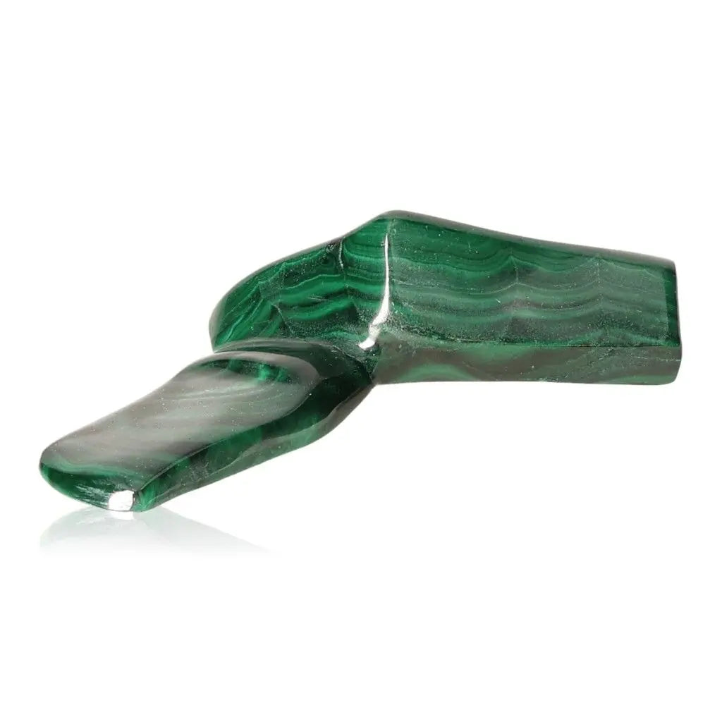 Polished green Malachite gemstone radiating soothing energy and transformative power on a white background.