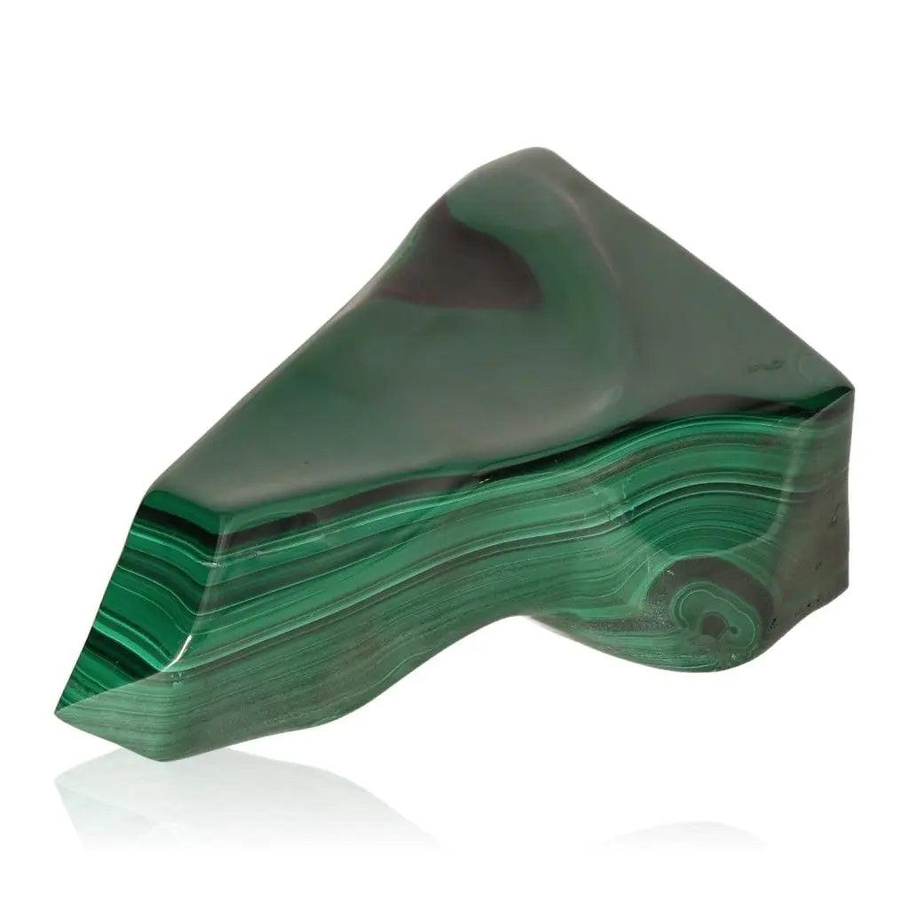 Polished malachite stone, known for soothing energy and courage, aiding in life changes and inner harmony.