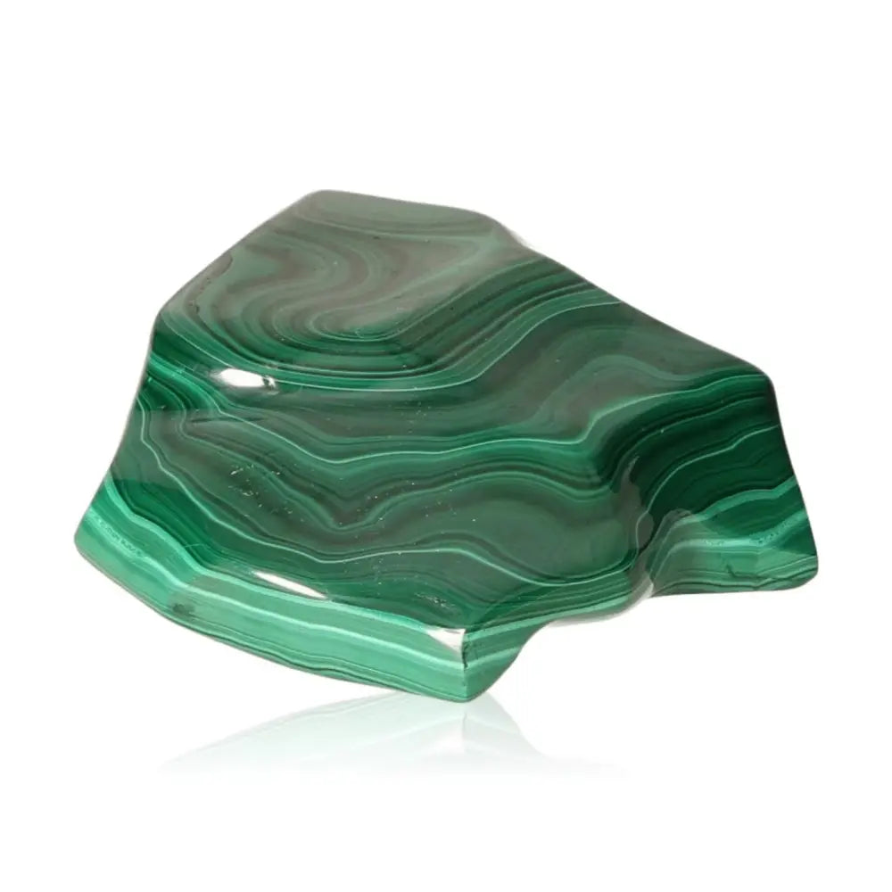 Polished malachite gemstone exuding rich green hues, renowned for its soothing energy and ability to foster courage and optimism.