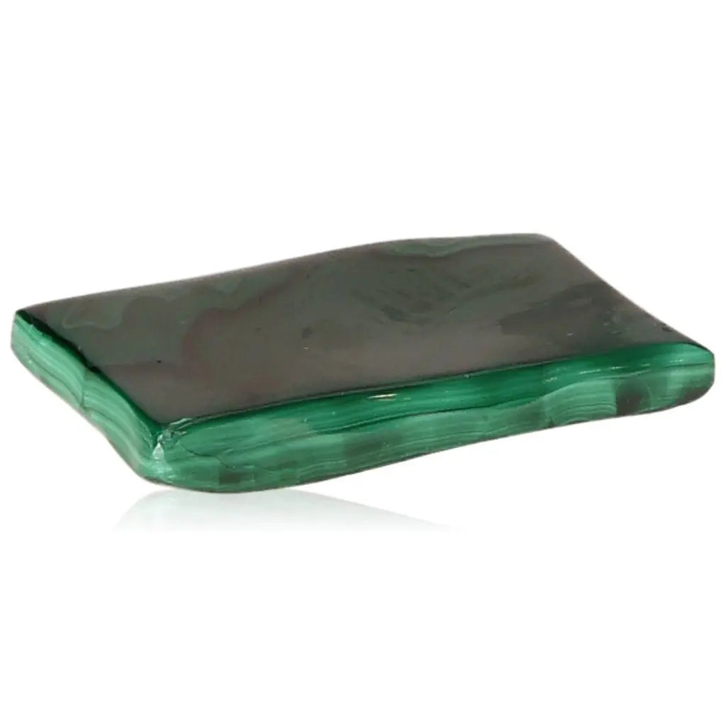 Polished malachite gemstone with deep green hues, showcasing its natural beauty and soothing energy.