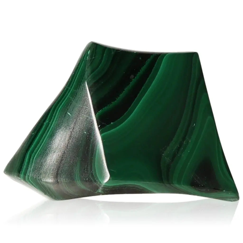 Polished malachite gemstone with vibrant green bands, known for its soothing energy and inspirational qualities.