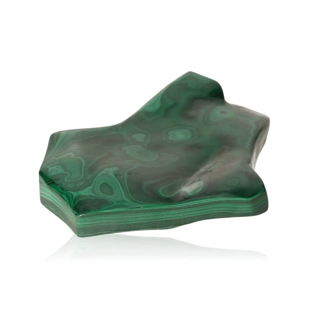 Smooth green malachite stone with natural patterns, known for soothing energy and promoting courage and optimism.