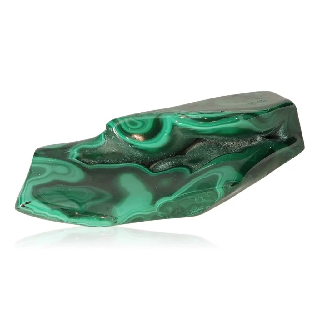Polished malachite gemstone displaying vibrant green hues and natural patterns, symbolizing tranquility and strength.