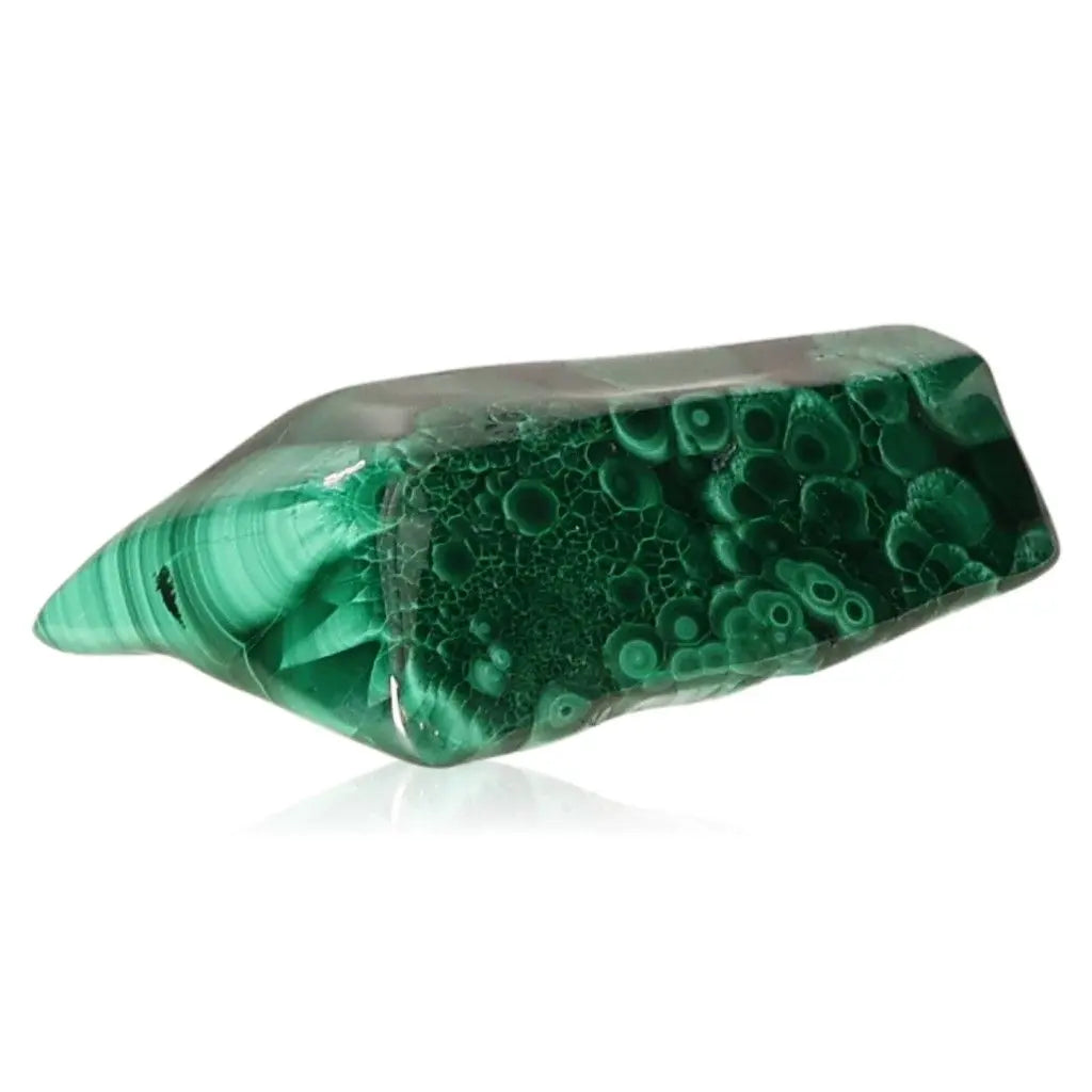 Polished malachite gemstone showcasing vibrant green patterns with a calming energy, symbolic of transformation and courage.