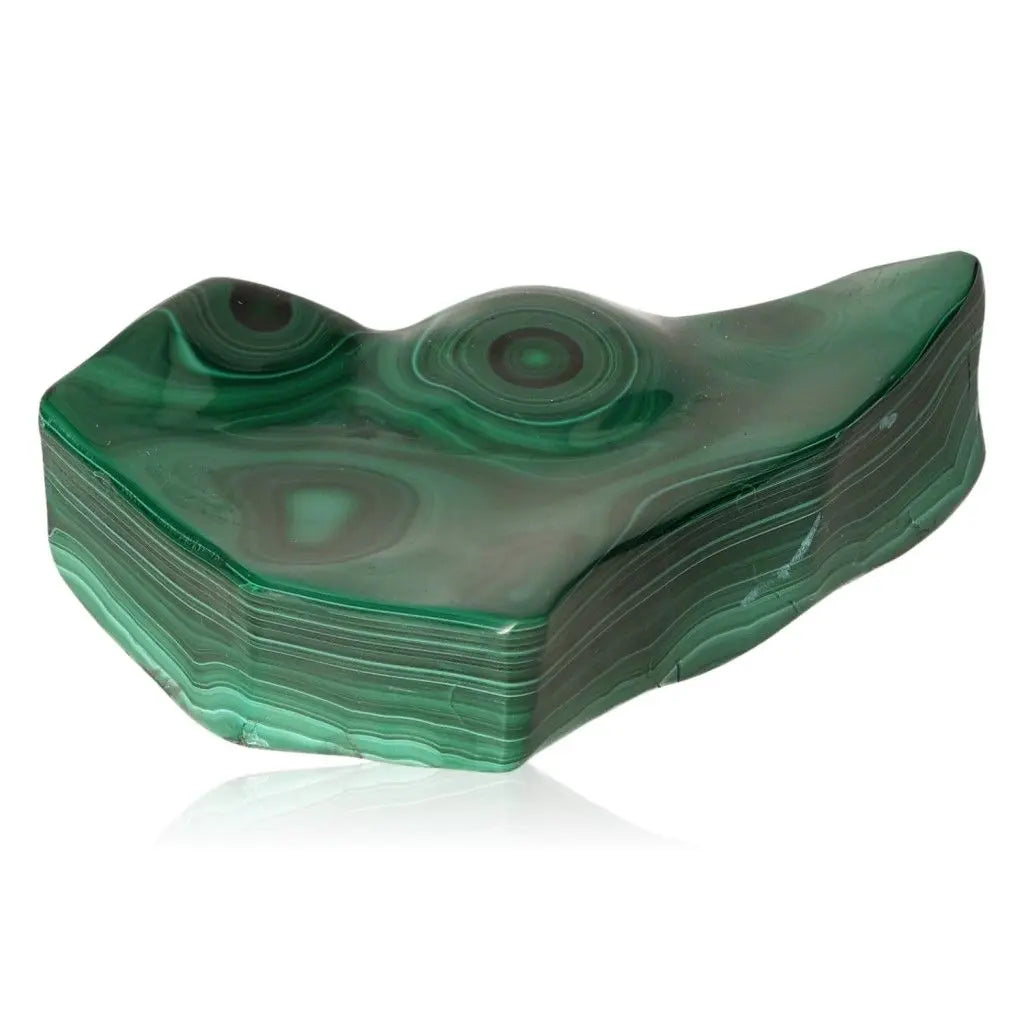 Polished green Malachite gemstone with unique patterns, known for its beauty and spiritual energies.