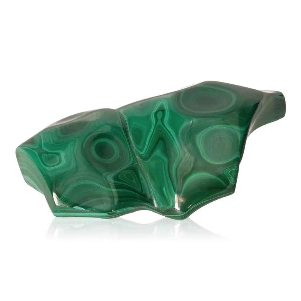 Polished green malachite stone with unique swirls, offering tranquil energy and courage for navigating life's transitions.