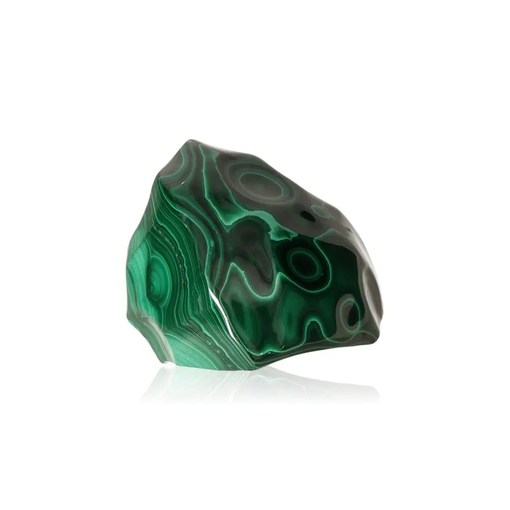 Polished malachite stone with striking banded patterns and rich green hues, symbolizing courage and tranquility.