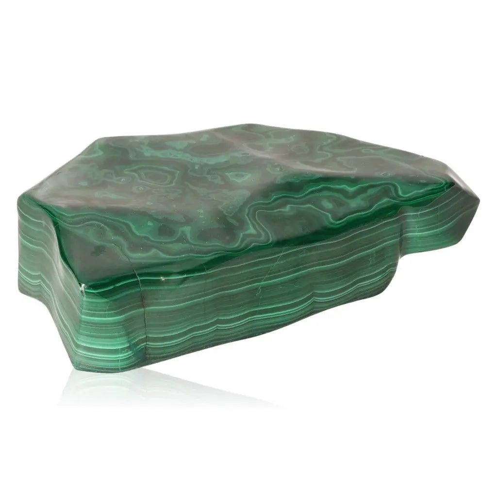 Polished green malachite stone with soothing energy, known for instilling courage and alleviating depressive states.