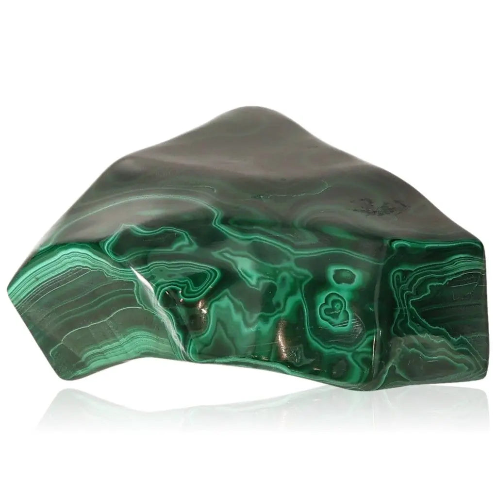 Polished Malachite stone, showcasing vibrant green swirls, symbolizes nature's energy and brings soothing, transformative elegance.