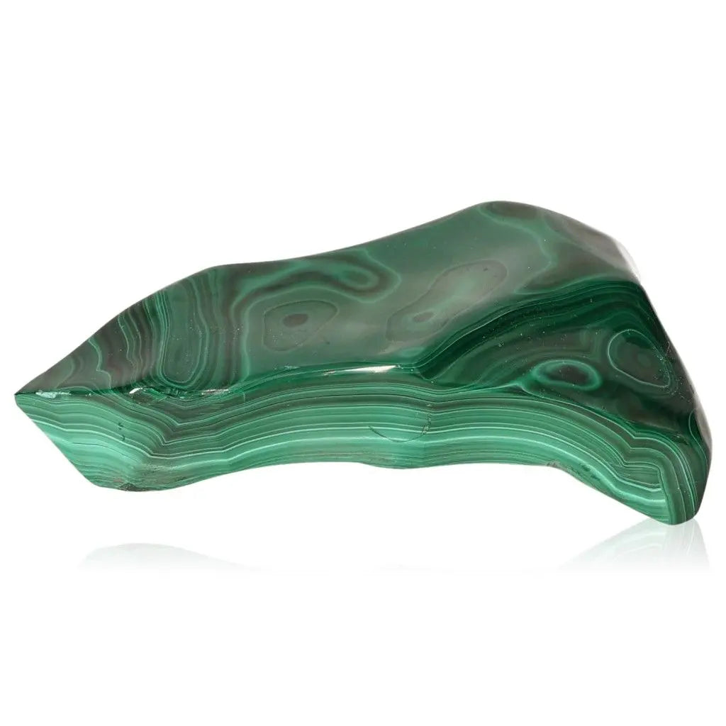 Polished green Malachite gemstone showcasing its vibrant, natural patterns, symbolizing nature's energy and transformation.