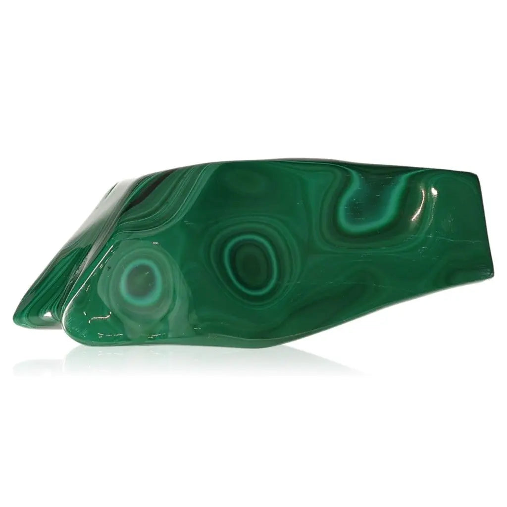Vibrant Malachite gemstone showcasing its natural green bands and swirls, known for emotional balance and spiritual insight.