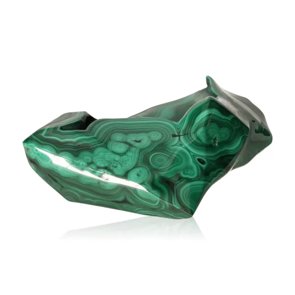Polished Malachite gemstone showcasing vibrant green swirls and patterns, known for emotional balance and transformative energy.