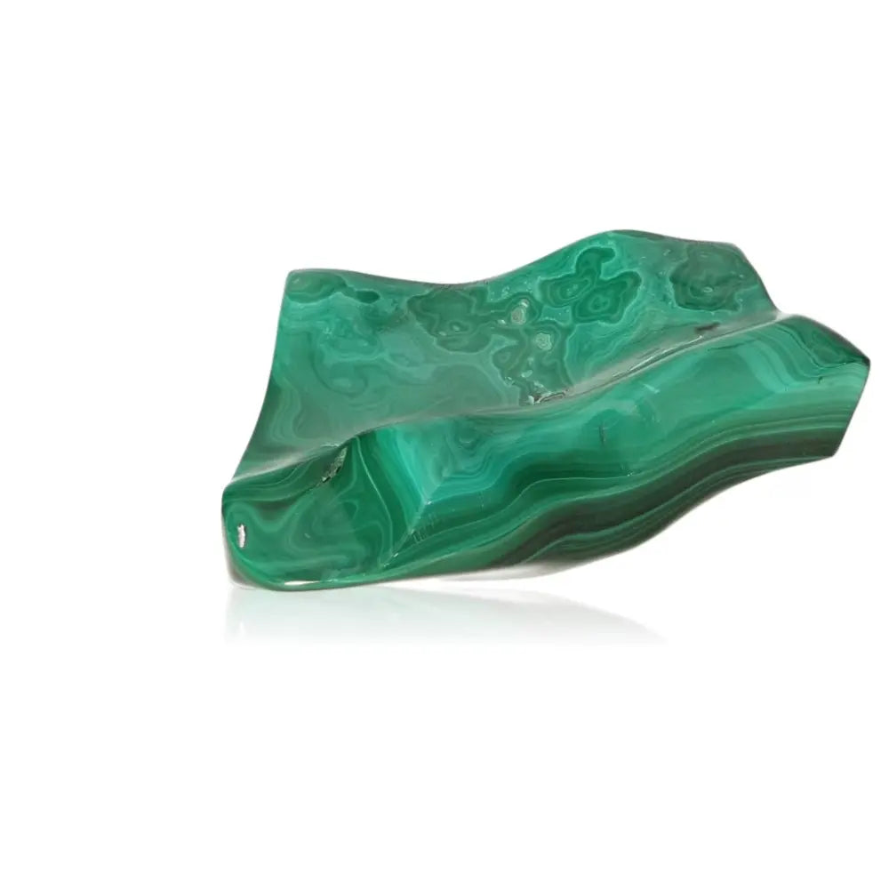Polished green malachite stone showcasing natural patterns and soothing energy, embodying courage and hope.