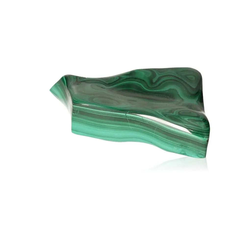Polished Malachite gemstone displaying soothing green bands and natural patterns, known for its transformative energy and calming effects.
