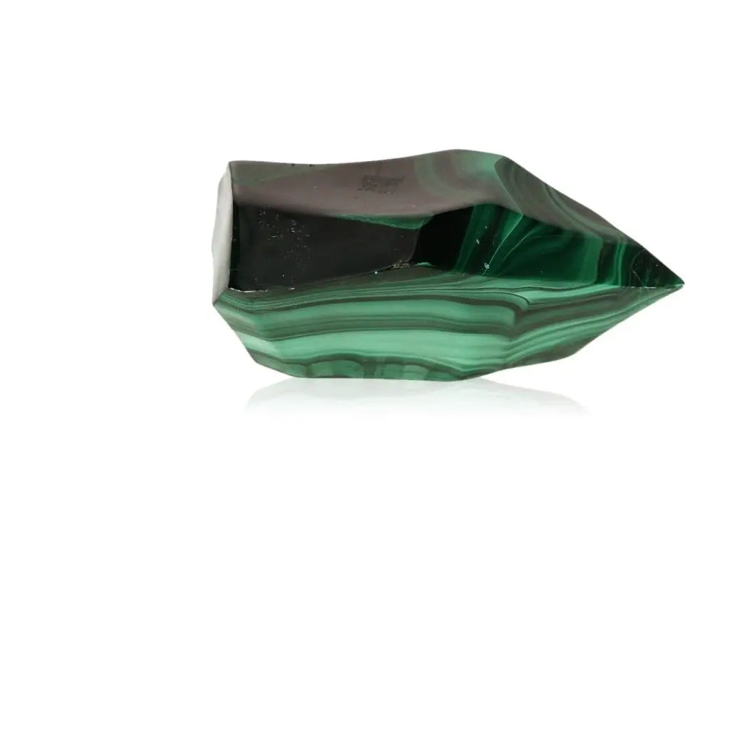 Vibrant green Malachite gemstone with swirling patterns, known as a stone of nature, symbolizing courage and hope.