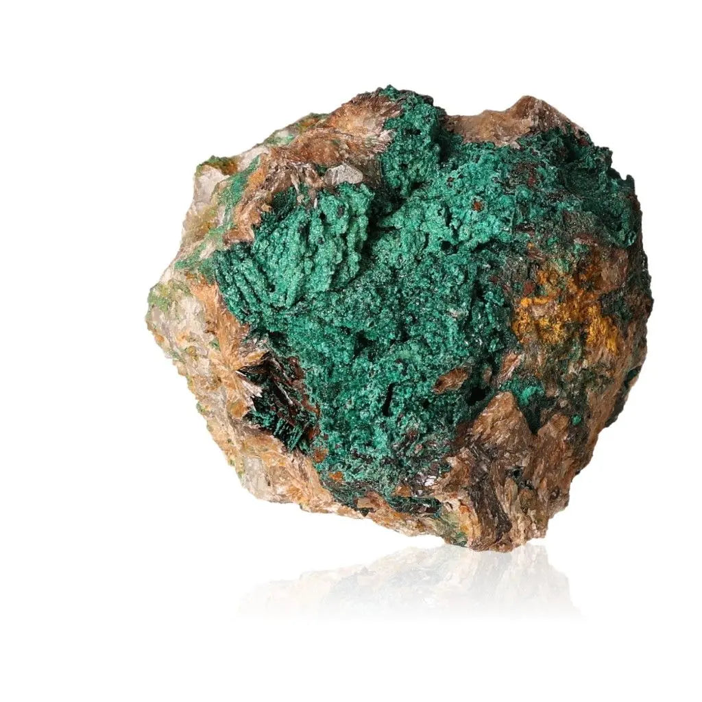 Natural green malachite druzy stone against white background, showcasing unique textures and vibrant colors.