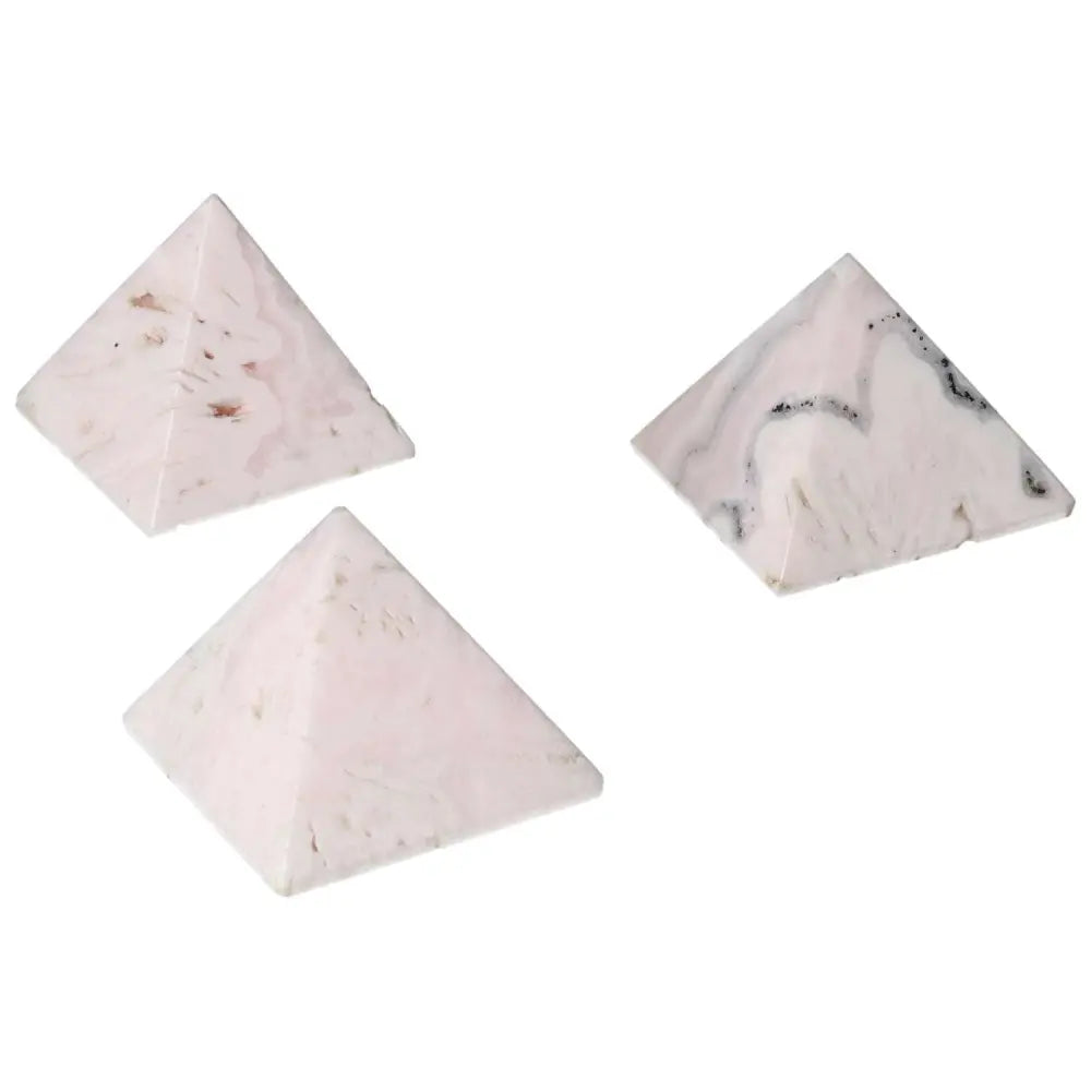 Three manganocalcite pyramids for healing, creativity, and calming energy.