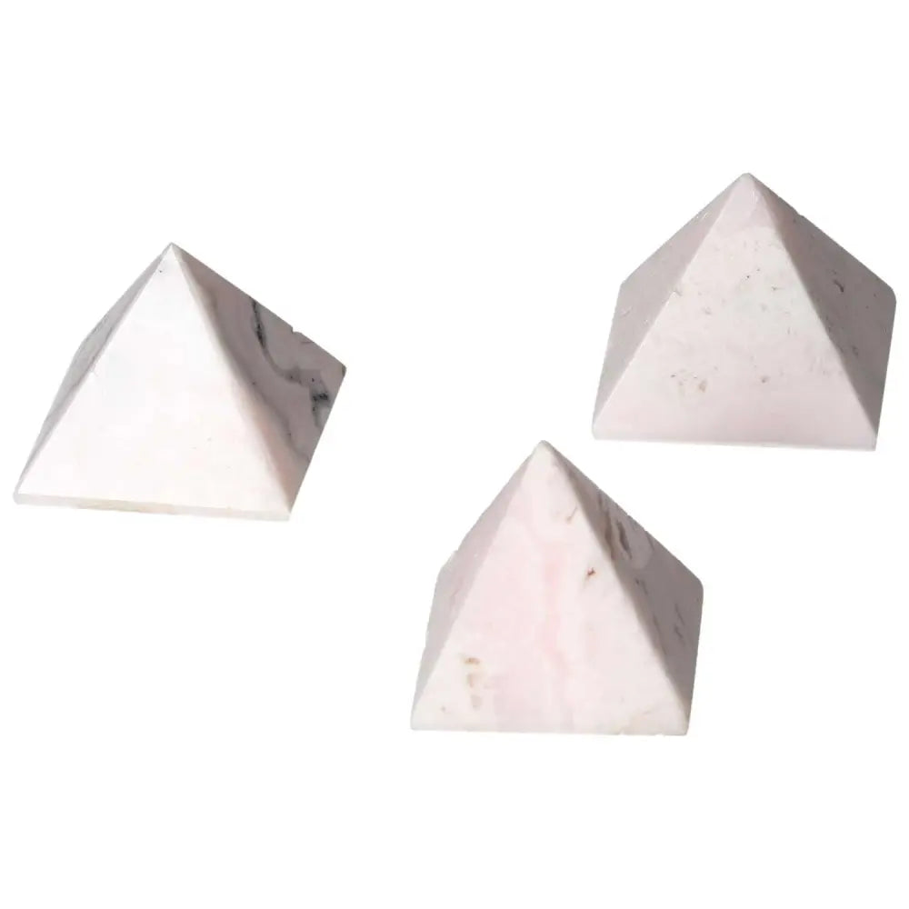 Three pink manganocalcite pyramids, powerful healing crystals for enhancing creativity and peace by clearing negative energy.