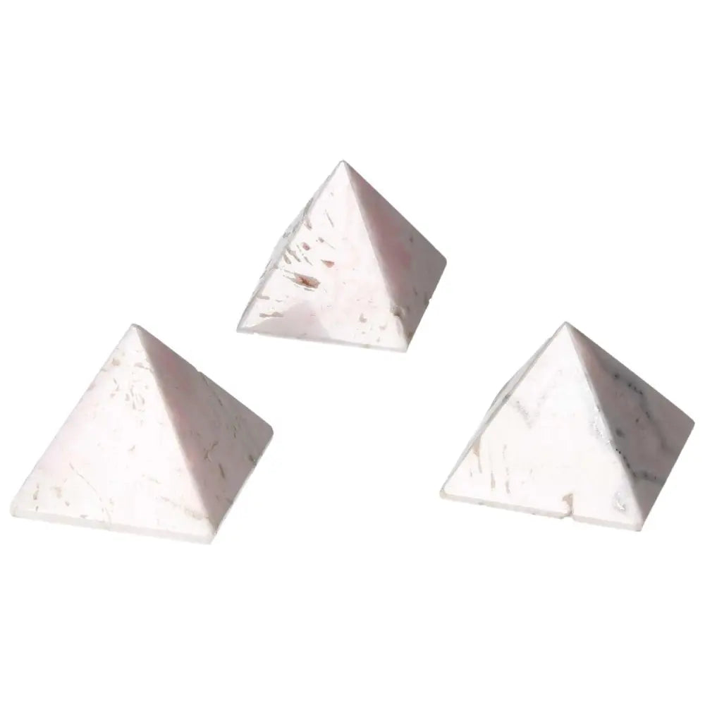 Three mangano calcite crystal pyramids for healing energy, promoting peace and creativity.