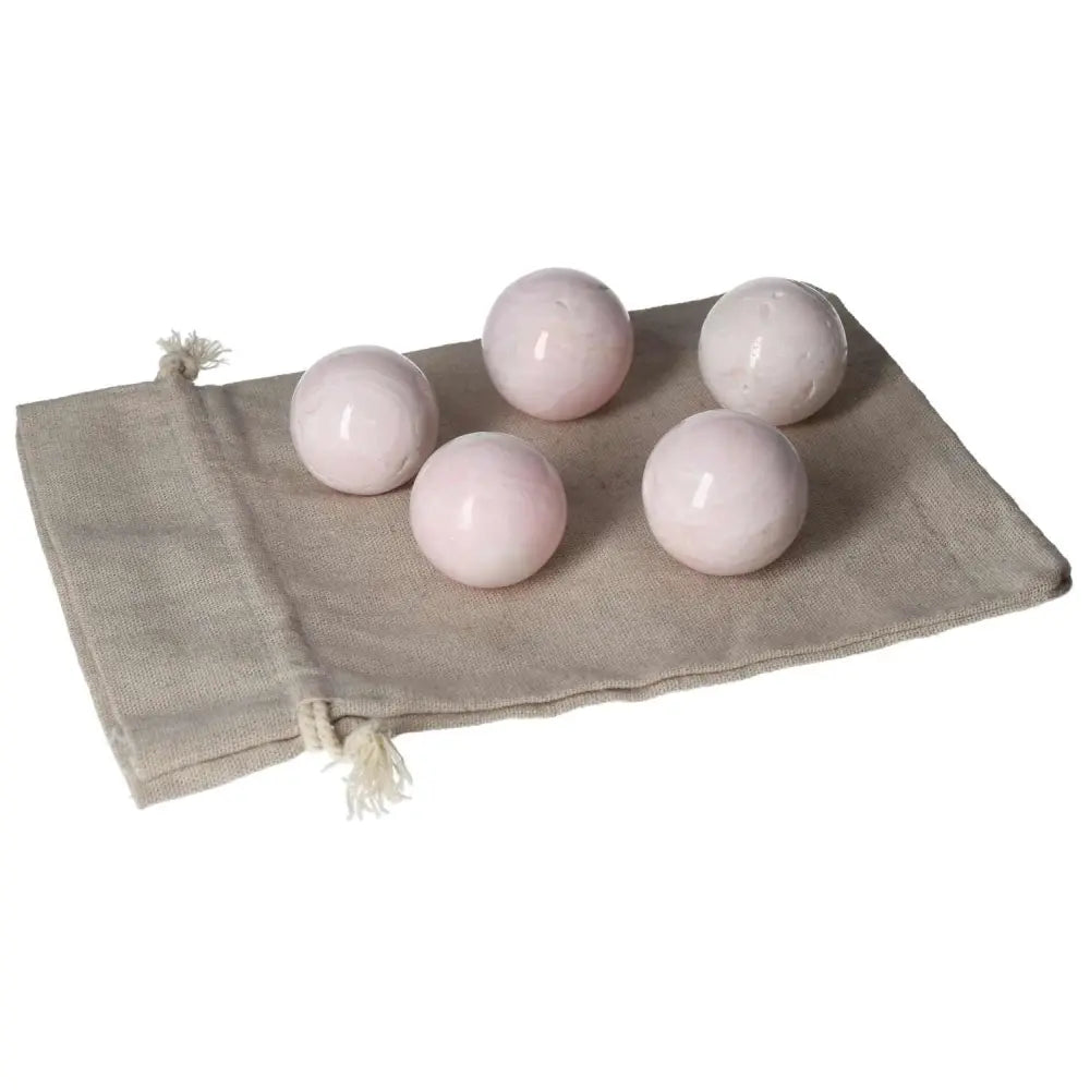 Five Manganocalcite Spheres on a Beige Cloth Bag, Healing Crystals for Peace and Creativity
