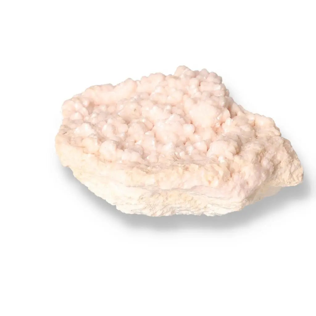 Manganocalcite gemstone from Sylvia Crystals, a delicate pink "Stone of Love" for compassion, emotional healing, and conscious luxury.