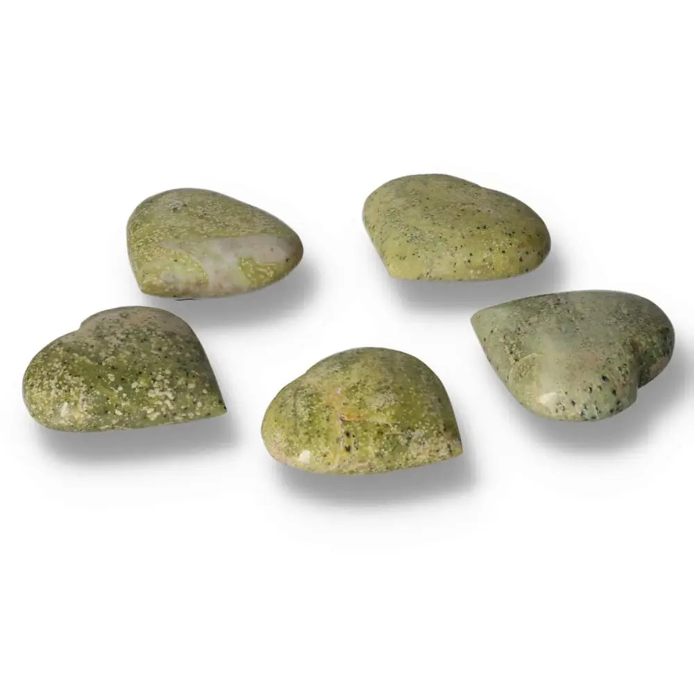 Five medium serpentine heart crystals showcasing their vibrant green hues and grounding properties, perfect for emotional balance and décor.